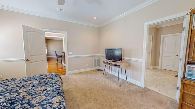 carpeted bedroom with ceiling fan and crown molding