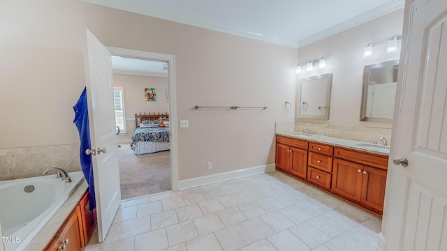 bathroom with tile patterned floors, crown molding, a bathtub, and vanity