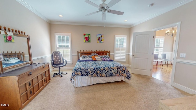 bedroom with ceiling fan with notable chandelier, crown molding, and light carpet