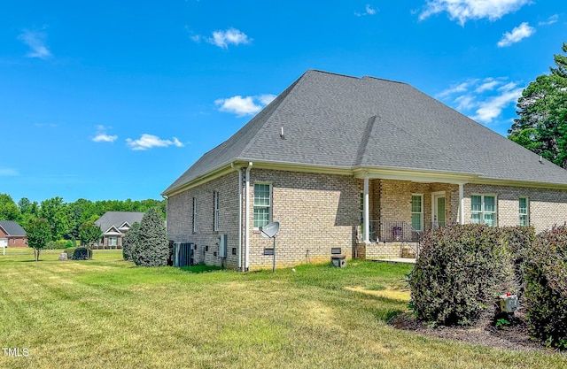 rear view of house with a yard