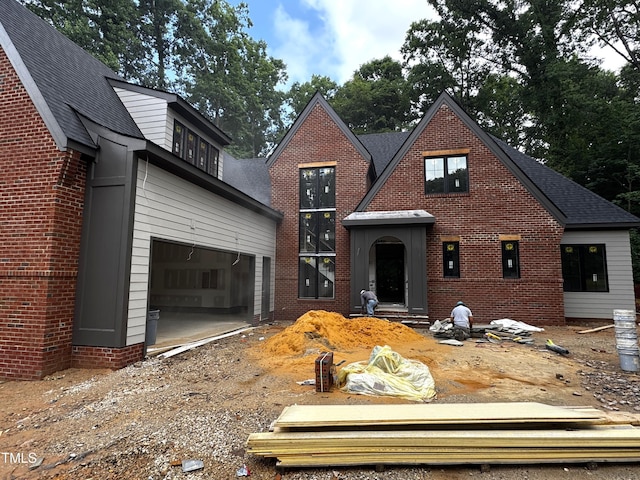 708 Catawba St, Raleigh, NC 27609 - view of front facade featuring a garage, brick siding, and driveway