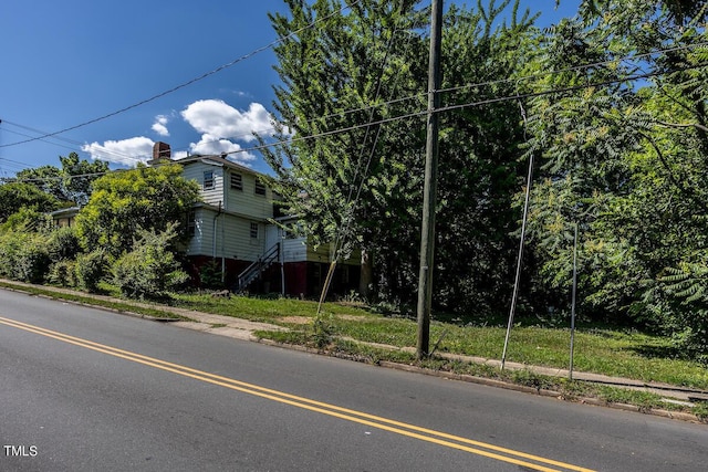 view of street with sidewalks and curbs