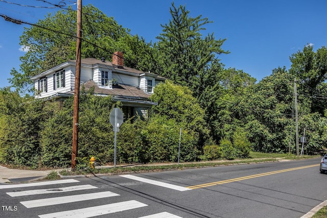 view of side of property with a chimney