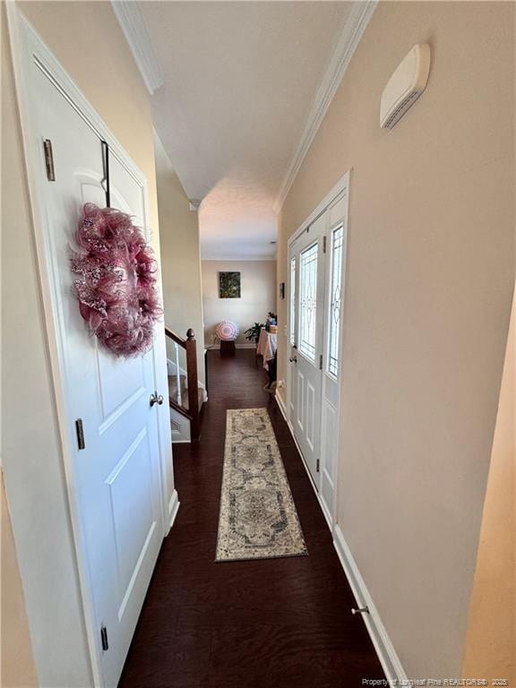 interior space featuring dark hardwood / wood-style flooring and ornamental molding