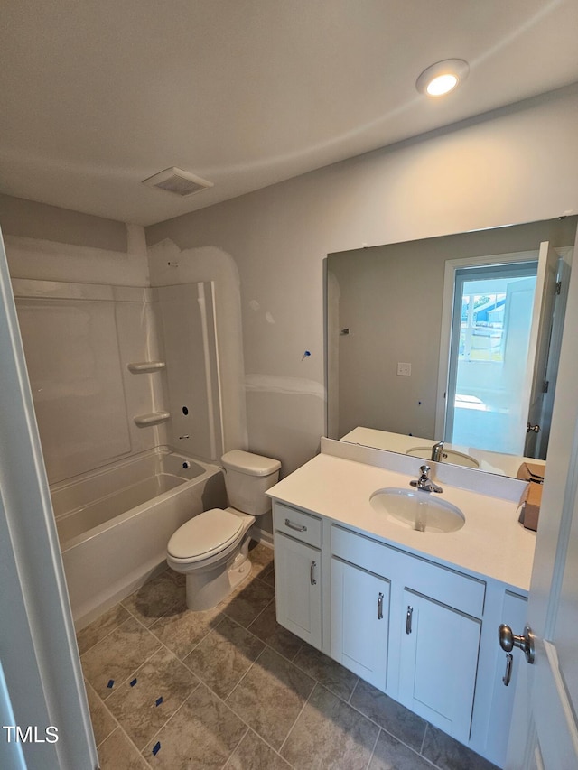 full bathroom featuring vanity, bathing tub / shower combination, toilet, and tile patterned flooring