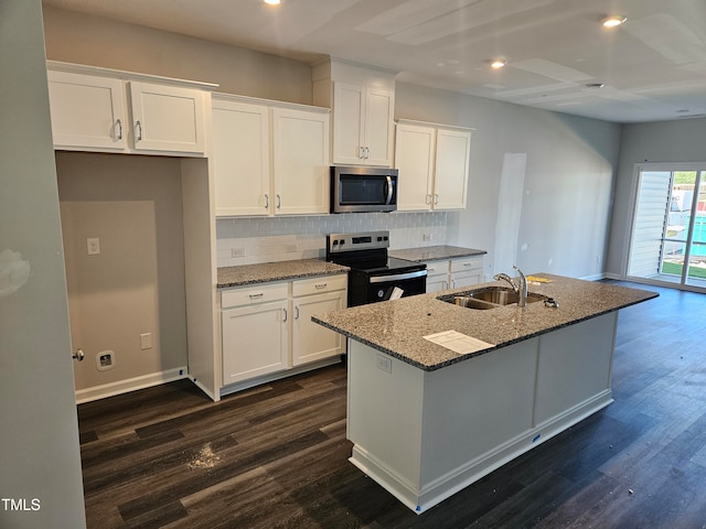 kitchen featuring appliances with stainless steel finishes, a center island with sink, sink, and white cabinets