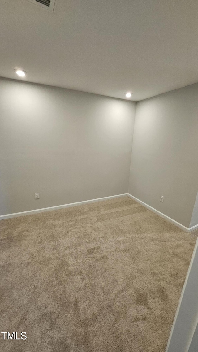 spare room featuring carpet