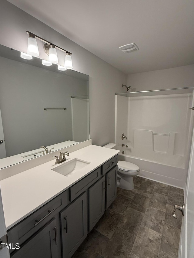 bathroom with visible vents, vanity, toilet, and shower / bathtub combination