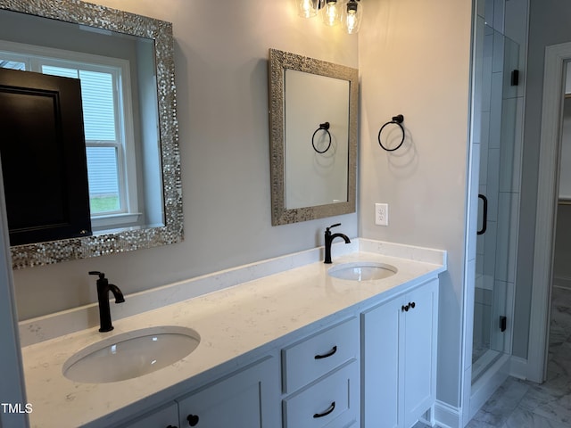 bathroom with vanity and a shower with shower door