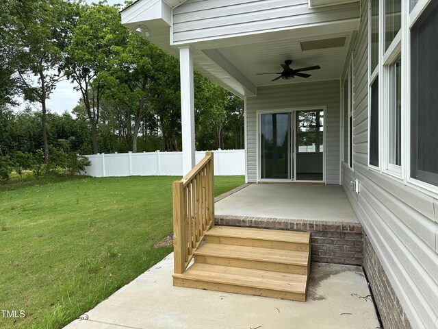 exterior space with a lawn, a patio, and ceiling fan