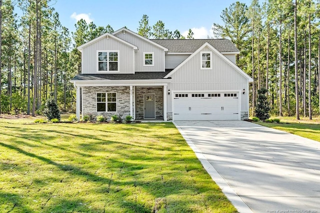 view of front of property with a garage and a front lawn