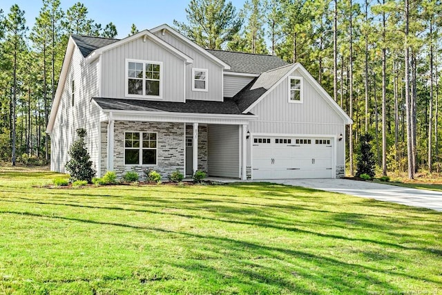 view of front facade featuring a garage and a front lawn