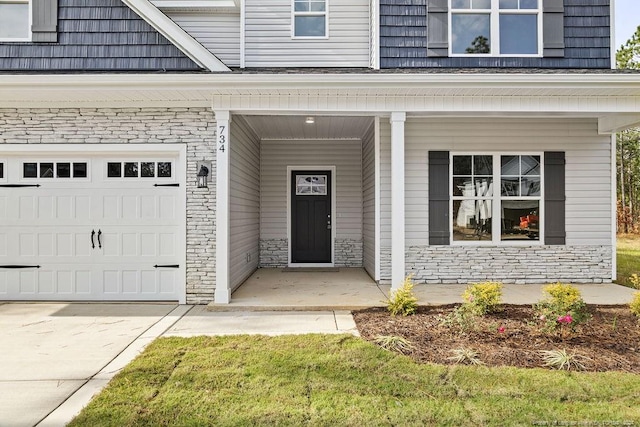 view of exterior entry with a garage