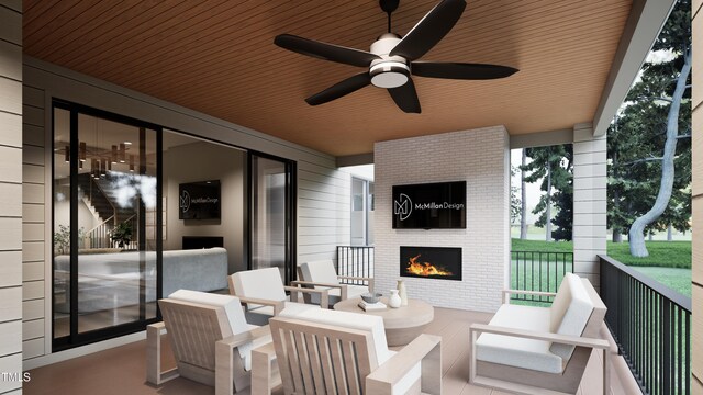 view of patio with an outdoor living space with a fireplace and ceiling fan