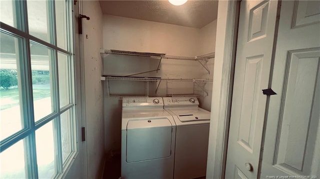 laundry area featuring washing machine and clothes dryer