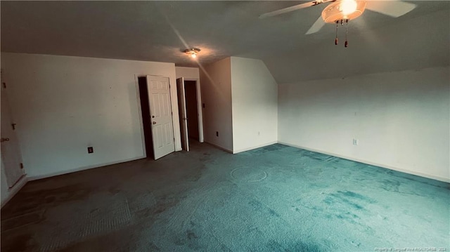 additional living space featuring ceiling fan, vaulted ceiling, and carpet floors