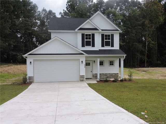 view of front of home with a garage and a front yard