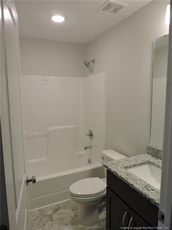 full bathroom featuring vanity, toilet, and washtub / shower combination