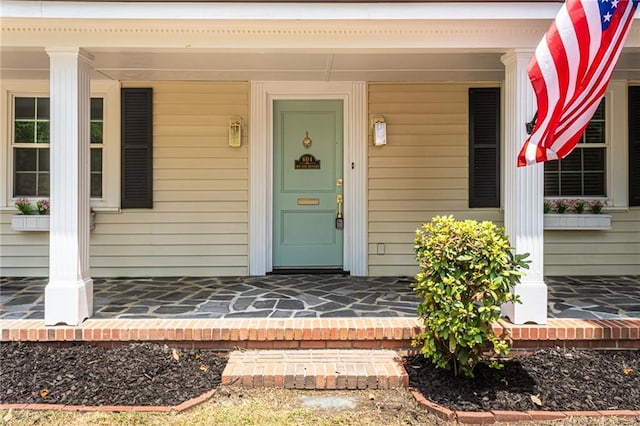 doorway to property featuring a porch