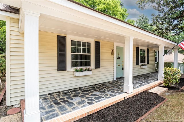 doorway to property with covered porch