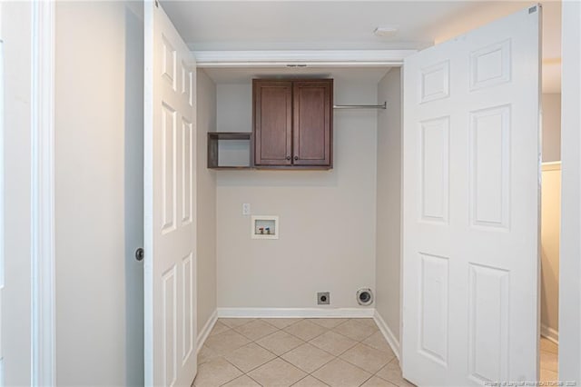 washroom with light tile patterned floors, hookup for a washing machine, baseboards, cabinet space, and electric dryer hookup