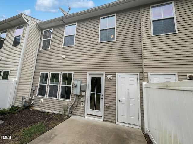 rear view of house featuring a patio