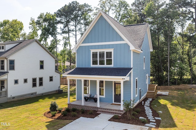 view of front of home featuring a front yard and covered porch