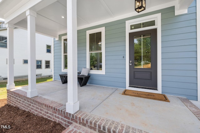 doorway to property with a porch