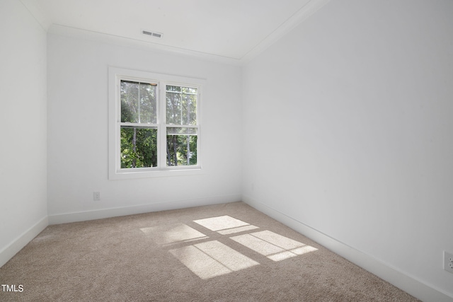 unfurnished room with light carpet and ornamental molding