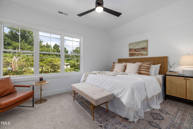 bedroom with vaulted ceiling, carpet, and ceiling fan