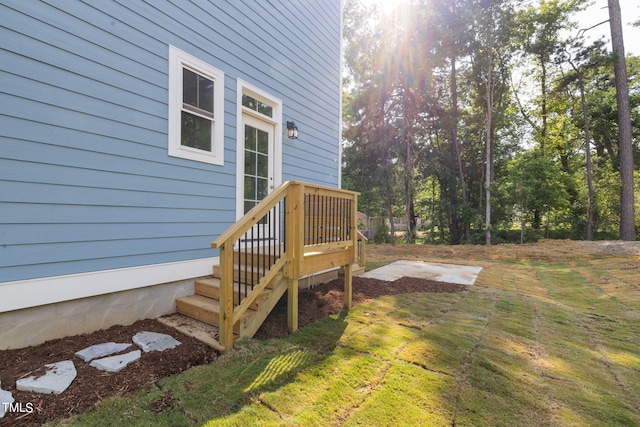 deck with a lawn and a patio