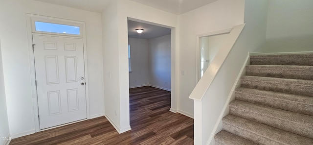 entryway with dark wood-type flooring