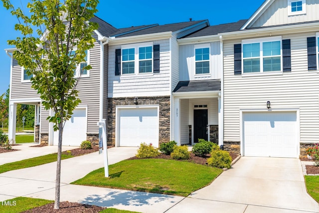 multi unit property featuring a garage