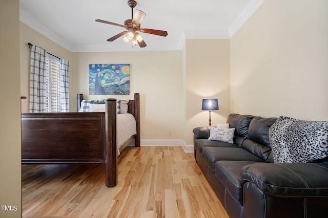 bedroom with ornamental molding, ceiling fan, and light hardwood / wood-style flooring