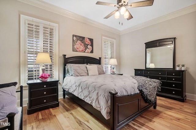 bedroom with multiple windows, crown molding, ceiling fan, and light hardwood / wood-style flooring