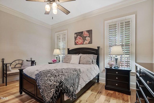 bedroom featuring crown molding, ceiling fan, and light hardwood / wood-style flooring