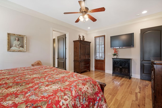 bedroom featuring crown molding, ceiling fan, and light hardwood / wood-style floors