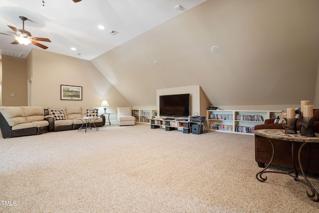 carpeted living room with vaulted ceiling and ceiling fan