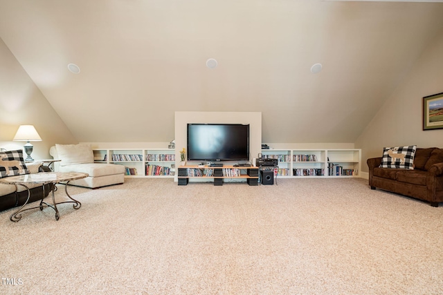 living room with lofted ceiling and carpet flooring