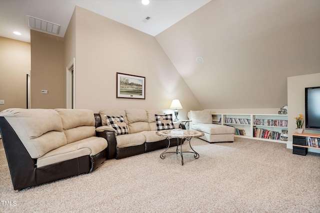 carpeted living room featuring lofted ceiling