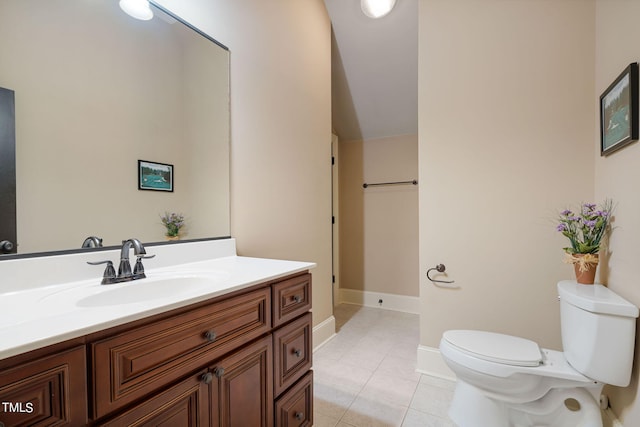 bathroom featuring tile patterned floors, vanity, and toilet