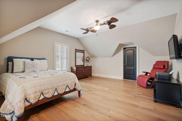 bedroom featuring lofted ceiling, light hardwood / wood-style floors, and ceiling fan