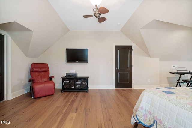 bedroom featuring lofted ceiling, wood-type flooring, and ceiling fan