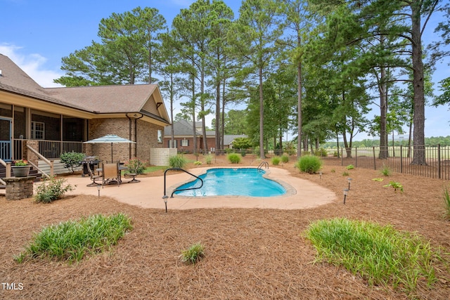 view of swimming pool with a patio area