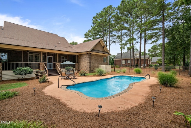 view of swimming pool featuring a patio area