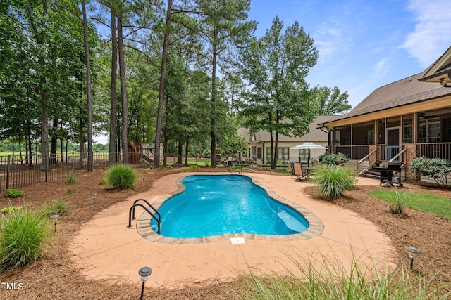 view of swimming pool featuring a patio