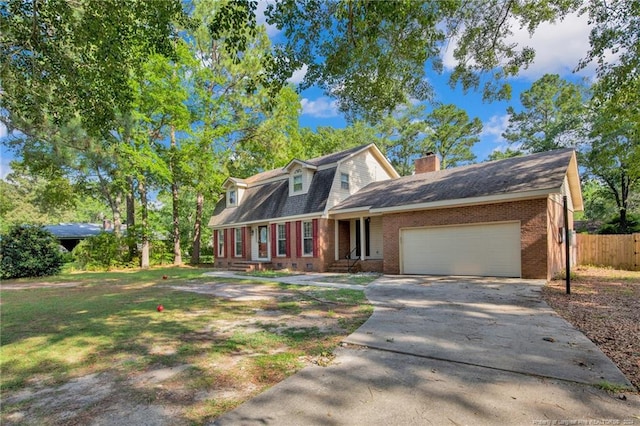 cape cod home with a garage