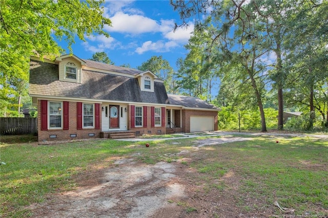 new england style home featuring a garage and a front yard