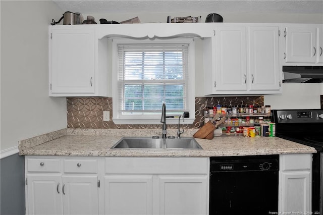 kitchen with white cabinets, wall chimney exhaust hood, black dishwasher, stove, and sink