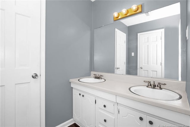 bathroom with dual bowl vanity